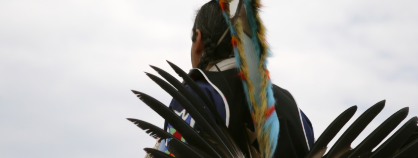 Native American dancer at traditional pow-wow.