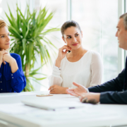 Businesspeople collaborating and talking through new ideas in office